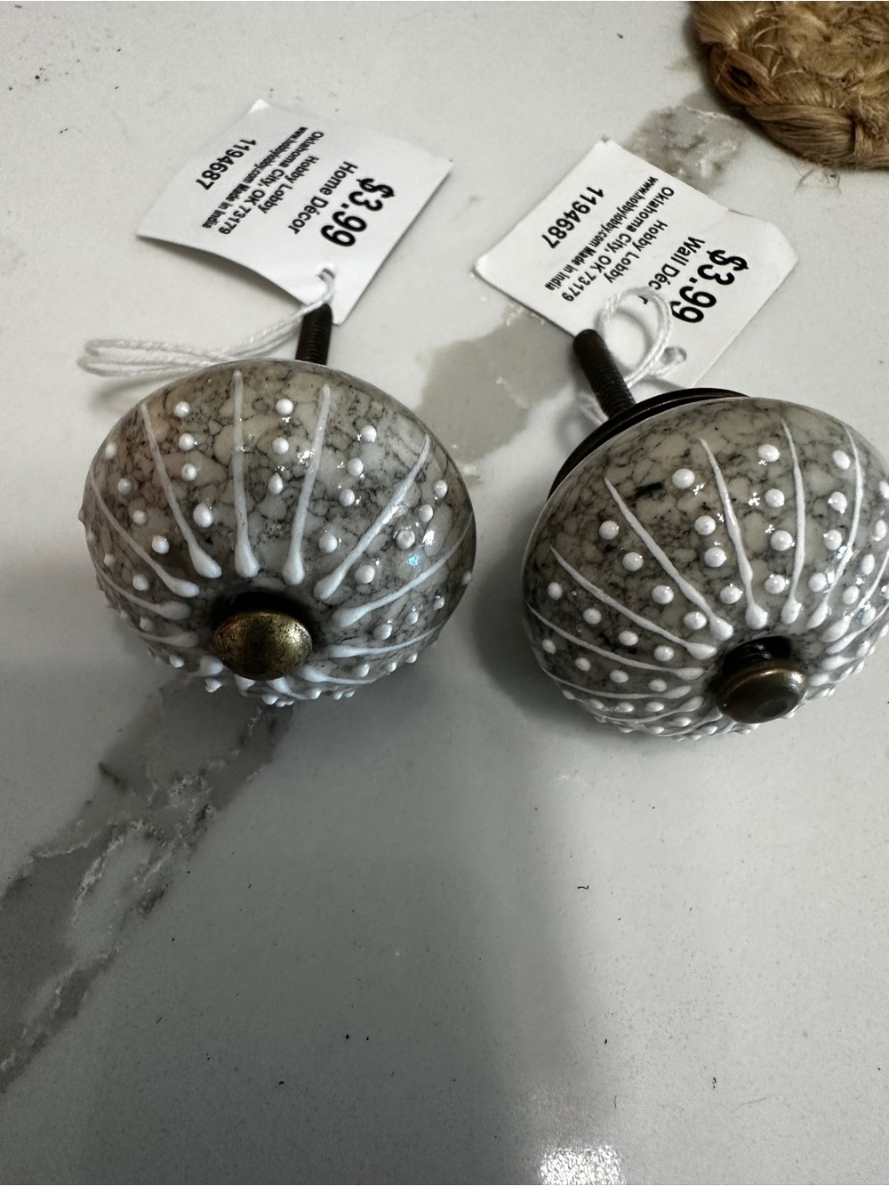 Hobby Lobby White Marble Ceramic Decorative Cabinet Knobs with Brass Accent.
